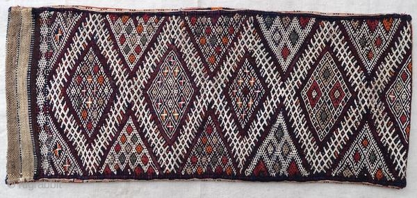 Authentic kilim cushion from the Moroccan Middle Atlas, circa 1950.

Origin : Morocco
Period : around 1950
Size : 84 x 36 cm
Material : wool and cotton
Good general condition
Handwoven

✦ Price and photos on www.christiandoux.com/products/moroccan-pillow-84-36  