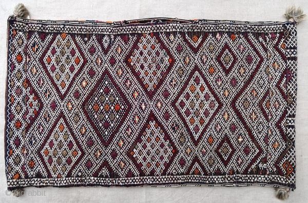 Authentic kilim cushion from the Moroccan Middle Atlas, circa 1950.

Origin : Morocco
Period : around 1950
Size : 66 x 37 cm
Material : wool and cotton
Good general condition
Handwoven

✦ Price and photos on www.christiandoux.com/products/moroccan-pillow-66-37  