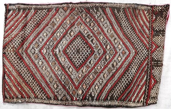 Authentic kilim cushion from the Moroccan Middle Atlas, circa 1950.

Origin : Morocco
Period : around 1950
Size : 57 x 36 cm
Material : wool and cotton
Good general condition
Handwoven

✦ Price and photos on www.christiandoux.com/products/moroccan-pillow-57-36  