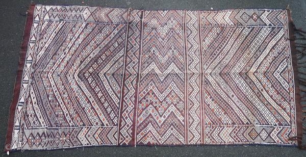 Berber kilim from the Middle Atlas in Morocco, made in 1950 or before, and in good general condition with two tears. This authentic piece has not been woven for trade.

Origin : Morocco
Period  ...