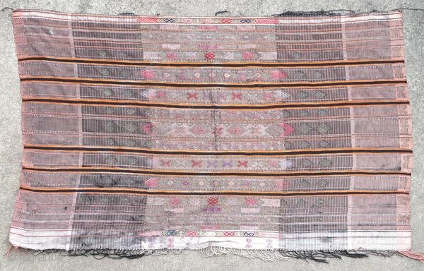 Ancient wedding veil Djerba (Tunisia), 1900 or before.

Origin : Tunisia
Period : 1900 or before
Size : 135 x 82 cm
Material : cotton, silk and metal thread
Wear, holes and stains
Handwoven

This textile has been cleaned  ...