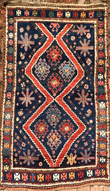 Charming, powerful Karabagh rug, a fireworks of joy, 218x128cm. Full pile, all endings original, gently washed. Some small holes, easy to repair.           