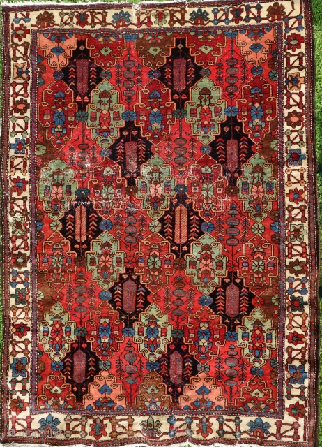 Bakhtiar from the village Âbâdji, circa 1900, 200x143cm, rare border, saturated colours, including beautiful pistachio green, good pile all over, damage in the middle field, 3 tears in the upper and bottom  ...