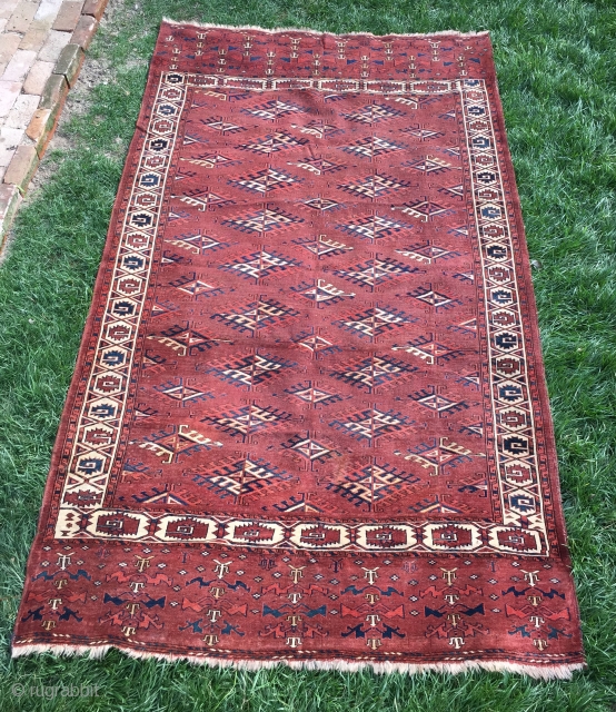 Early Yomud main carpet, 5'1" x 9'0". Even low pile.  Sides and ends original, approximately 1% expert field restoration.  The spacious drawing of this usually crowded pattern and somewhat archaic  ...