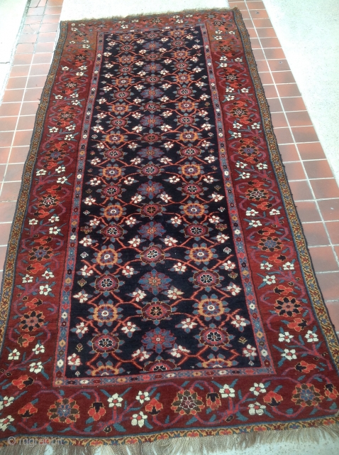 Striking Kurd kelleh, saturated all natural colors on glossy wool. Deep blue-black field, mahogany red/brown major border. 11'4" x 5'4". Ends rewoven, otherwise pretty much full, unrestored pile.     