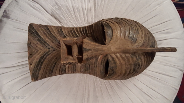 This "Kifwebe" mask belong to the Bwadi Bwa Kifwebe secret society of men of the Songye ,in southeast of Congo.The masks appear with full-body costumes made of bast fibres for initiationsa,funerals or  ...