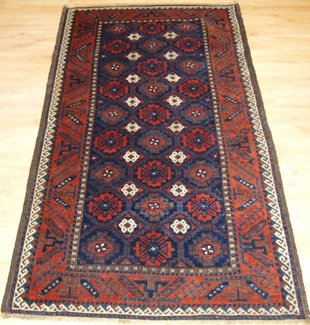 Antique Baluch rug from Khorassan region of Eastern Persia with a well drawn mina khani lattice design. www.knightsantiques.co.uk 

Size: 5ft 5in x 2ft 11in (164 x 90cm).

Circa 1900.

A good Baluch rug with  ...