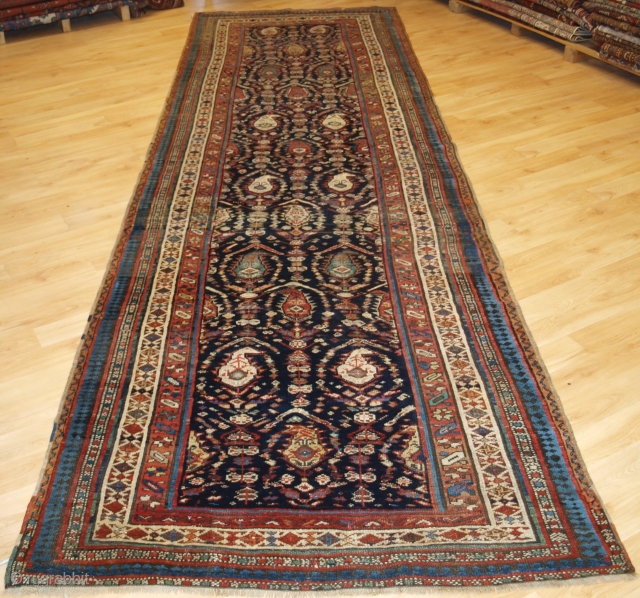 Antique South Caucasian Kurdish or Shahsavan runner, with all over boteh and shrub design. www.knightsantiques.co.uk 

Size: 12ft 11in x 3ft 11in (394 x 120cm). 

Circa 1880.

The indigo field is filled with large  ...