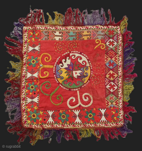 Uzbek ilgich, silk embroidery on Mogul red cotton. Size: 50 x 50cm excluding tassels.                   