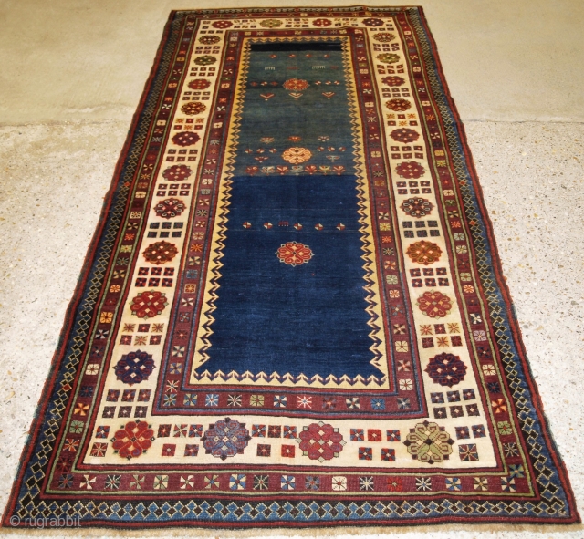 
Antique Caucasian Talish long rug with abrashed indigo blue field. www.knightsantiques.co.uk Size: 8ft 2in x 3ft 8in (250 x 113cm). 

Late 19th century.

The rug has a classic Talish design and border, the  ...