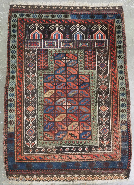 Antique Baluch prayer rug of scarce form, attributed to the 'Baluch of Turkestan' by Craycraft.
Circa 1880.
A scarce and colourful Baluch rug, the central panel is of the well known 'tile' design. Other ...