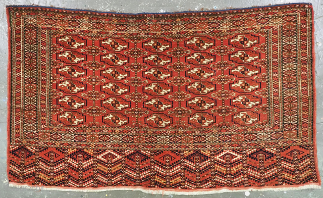 Antique Tekke Turkmen chuval face with 30 small chuval guls.
Size: 4ft 0in x 2ft 5in (123 x 73cm).
Circa 1880 or earlier.

A good chuval face with five rows of six small chuval guls  ...