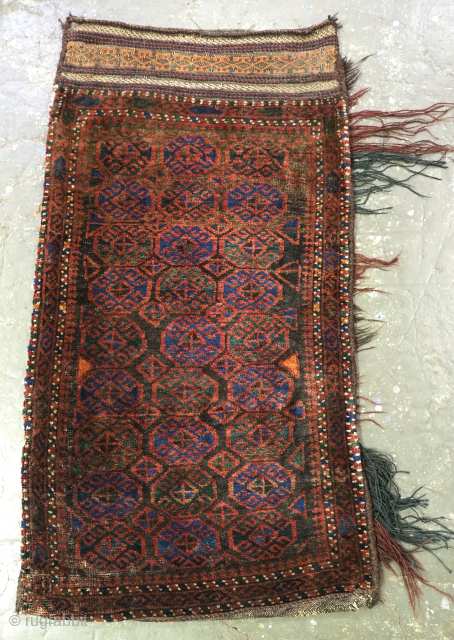 Antique Afghan Baluch storage or grain bag; these are known as ‘balisht’.
Size: 3ft 5in x 1ft 10in (105 x 56cm).
Circa 1920.

This example has a repeat octagon design to the face with a  ...