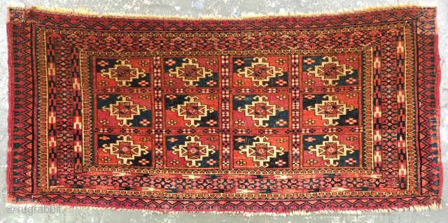 Antique Tekke Turkmen mafrash, face of a small storage bag.
Size: 3ft 1in x 1ft 5in (95 x 43cm).
Circa 1870 or earlier.
This small Tekke Turkmen mafrash is the face of a small bag ...