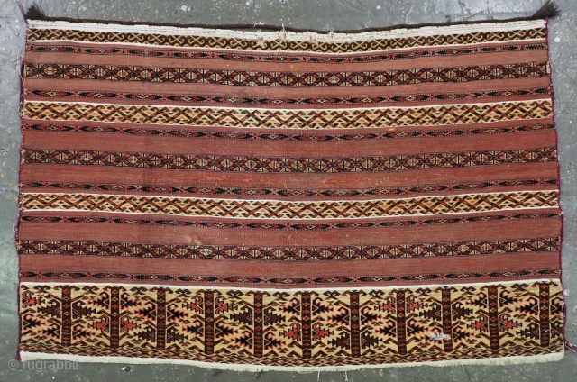 Antique Tekke Turkmen 'ak' chuval face with a banded design in mixed techniques.
Size: 3ft 10in x 2ft 5in (117 x 73cm).
Circa 1870.
Chuval are storage bags used by the Turkmen nomads for the ...