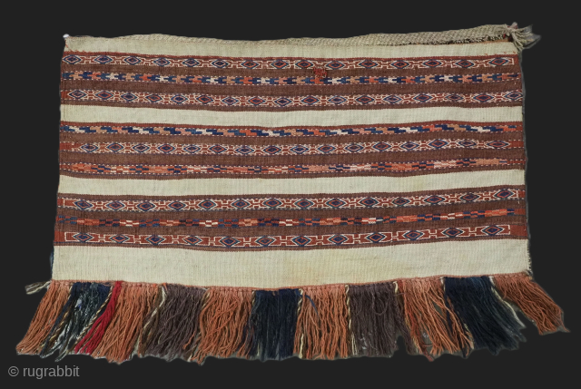 Antique Yomut Turkmen mafrash / torba in banded flatweave design.
Size: 2ft 6in x 1ft 5in (75 x 42cm) face size.
Circa 1900/20.

This small bag would have been used for the storage of personal  ...