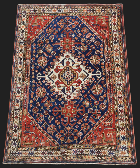 Antique south west Persian Qashqai tribal rug of small size.
Size: 6ft 3in x 4ft 4in (190 x 133cm).
Circa 1900.

A good Qashqai rug with a single medallion containing the Qashqai emblem on an  ...