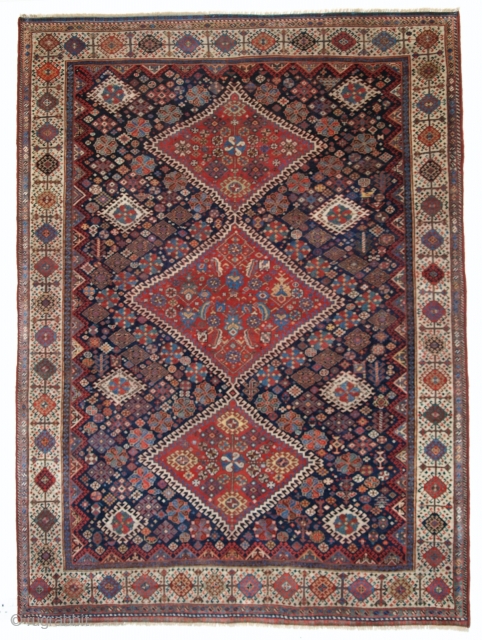 Antique South West Persian Qashqai rug, with triple latch hook medallion design, outstanding drawing and colour. The medallion is surrounded by a field filled with floral rosettes and tribal design elements. Note  ...