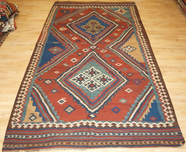 Size: 9ft 8in x 5ft 0in (295 x 152cm). www.knightsantiques.co.uk 

Antique Persian tribal Qashqai kilim, South West Persia.

Circa 1900.

A really outstanding Qashqai kilim with very bold graphic design and wonderful natural dye  ...