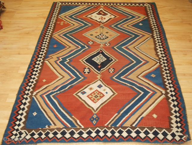 Size: 7ft 10in x 5ft 0in (238 x 152cm). www.knightsantiques.co.uk 

Antique Persian tribal Qashqai kilim, South West Persia.

Circa 1900.

A good Qashqai kilim with very bold eye dazzler design, natural dye colours throughout.  ...