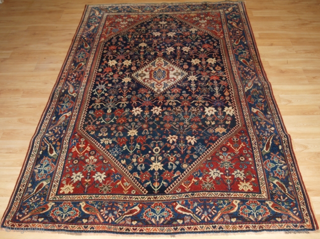 Antique South West Persian Kashkuli Qashqai rug with floral design. Note the unusual bird border. www.knightsantiques.co.uk Size: 7ft 7in x 4ft 9in (230 x 144cm). 

Circa 1900.

A very attractive rug by the  ...