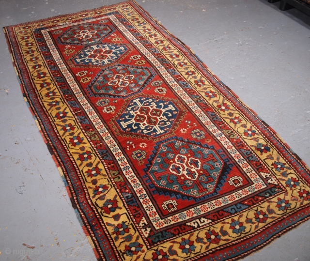 Size: 7ft 9in x 3ft 10in (236 x 116cm). Click the link www.knightsantiques.co.uk to view more items.

Antique South Caucasian Kazak long rug with a vertical row of five octagons on a clear  ...