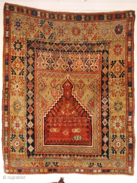 Antique Turkish Mujur prayer rug of classic design with a superb range of colours. www.knightsantiques.co.uk 
Size: 6ft 1in x 4ft 9in (186 x 145cm). 
Mid 19th century.

Mujur is in central Anatolia, this  ...