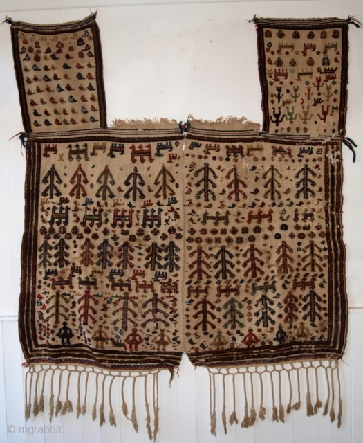 Antique Qashqai tribal horse cover. www.knightsantiques.co.uk 
Size: 5ft 0inx 4ft 9in (153 x 145cm) excluding tassels. 
Circa 1890.

The cover is on an ivory plain weave ground decorated with piled weaving with shrubs,  ...