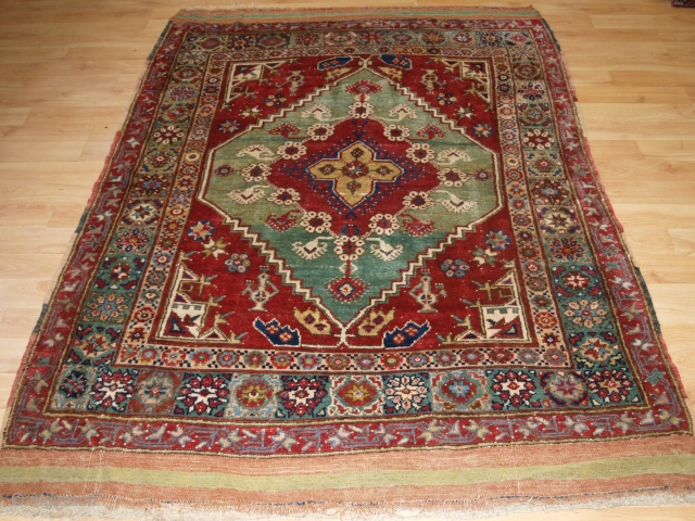 Antique West Anatolian rug from the small village of Dazkiri which lies on the road from Denizli to Sparta. www.knightsantiques.co.uk Size: 6ft 7in x 4ft 11in (200 x 150cm). 

Circa 1900.

The rug  ...