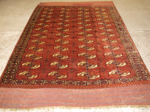 Antique Tekke Turkmen main carpet with 4 rows of 12 octagonal guls. www.knightsantiques.co.uk Size: 9ft 6in x 5ft 11in (290 x 180cm). 

Mid 19th century or earlier.

A rare Tekke Turkmen main carpet,  ...