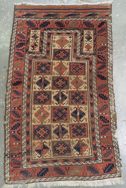 Size: 4ft 8in x 2ft 9in (142 x 85cm).

Antique Baluch prayer rug by the Yaqoub Khani sub tribe of the Timuri, with box design on a camel wool ground.

Circa 1870 or earlier.

This  ...