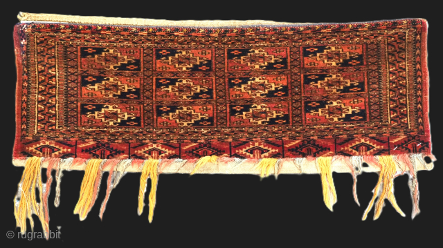 Antique Tekke Turkmen torba / mafrash, face of a small storage bag.
Size: 2ft 9in x 11in (83 x 27cm).
Circa 1880.
This small Tekke Turkmen torba / mafrash is a small bag used for ...