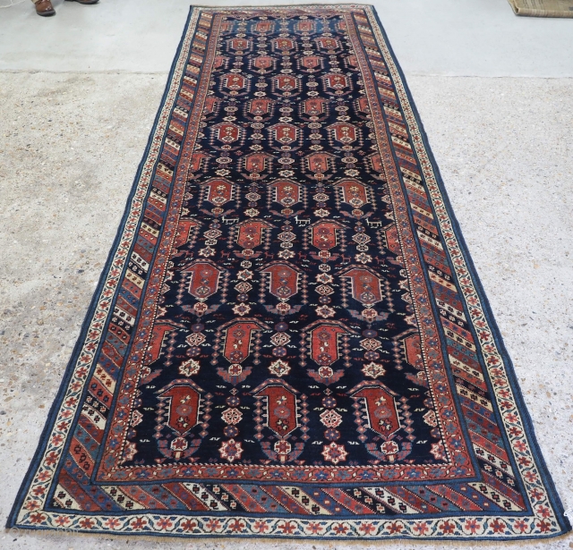 Antique Caucasian Kuba region Shirvan runner, with all over large boteh design. www.knightsantiques.co.uk 
Size: 11ft 6in x 3ft 10in (350 x 118cm). 
Circa 1880. 

The indigo field is filled with large boteh,  ...