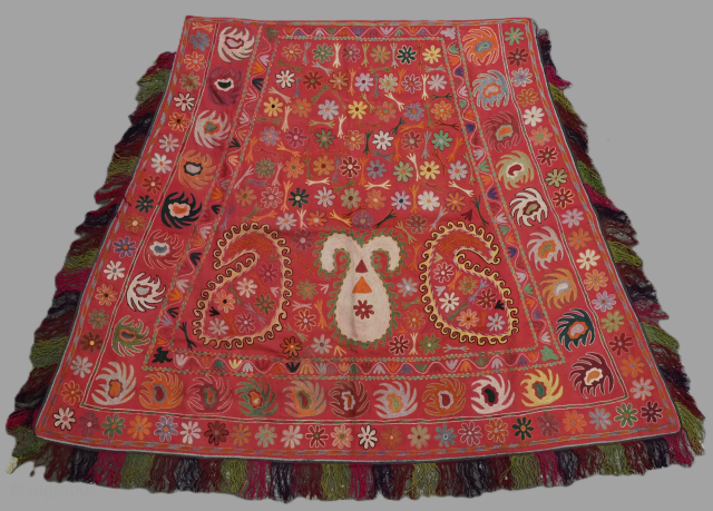 Antique Uzbek Lakai tribal ceremonial horse cover / saddle rug.
Size: 6ft 2inx 4ft 7in (189 x 140m) excluding tassels.
Circa 1920.
This beautiful embroidered horse / saddle cover was made by the Lakai tribe ...