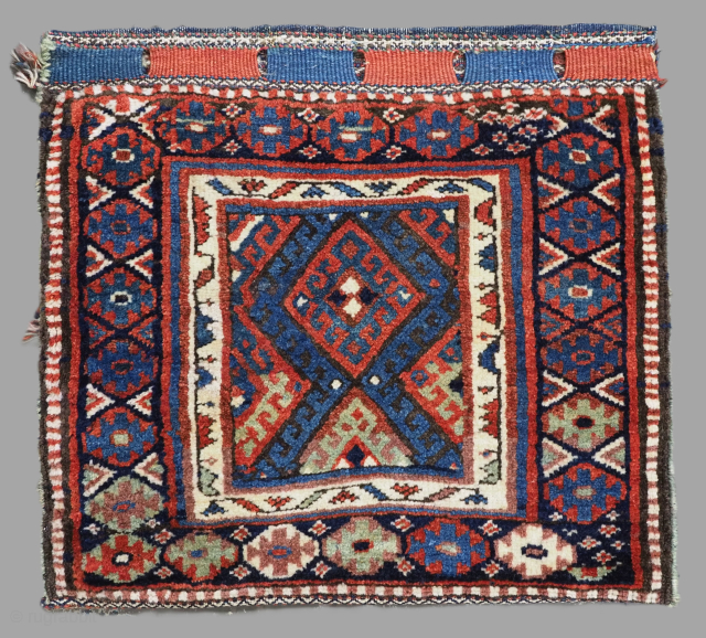 Antique Jaf Kurd bag with single diamond lattice design, good clear colours and an attractive plain weave back with unusual design.
Size: 2ft 2in x 1ft 11in (65 x 59cm).
Circa 1900.
The bag is ...