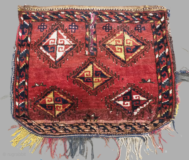 Antique tribal Uzbek saddle cover / rug with interesting design.

Circa 1900.
Size: 2ft 3in x 2ft 0in (69 x 60cm). Excluding tassels.
This excellent tribal saddle rug from Uzbekistan, features an interesting design with  ...