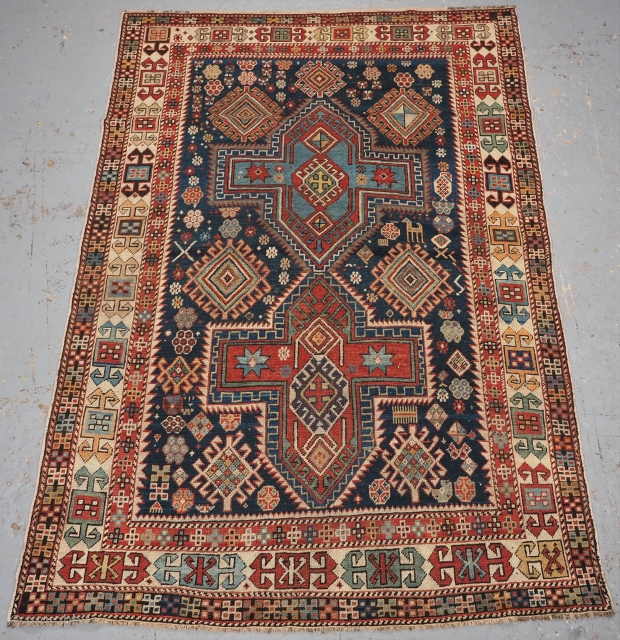 Antique East Caucasian Akstafa rug with twin medallions. www.knightsantiques.co.uk 
Size: 5ft 11in x 4ft 0in (180 x 122cm).
Circa 1890.

A good small rug with two cruciform medallions on a dark indigo blue ground.  ...