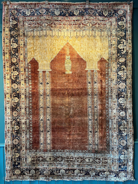 Antique Persian Heriz silk prayer rug with double column design and saffron yellow above the soft terracotta red field.

Circa 1890.

Size: 6ft 0in x 4ft 4in (183 x 132cm).

Please email: simon@knightsantiques.co.uk
   