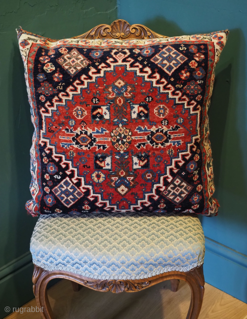 Antique saddle bag carpet cushion, the cushion is half of a saddle bag by the Qashqai tribe of southwest Persia, circa 1880.
The back is the original back of the saddle bag with ...