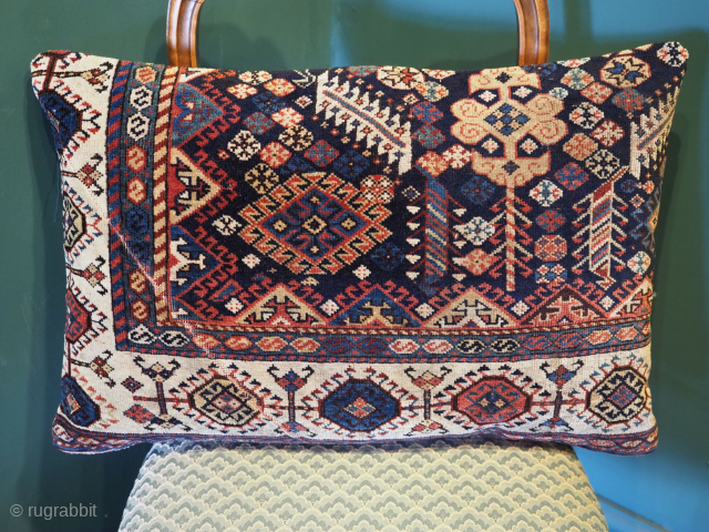 Antique carpet cushion, the face is a fragment from an antique southwest Persian Shekarlu Qashqai tribal carpet, circa 1870. There is a small wear crease, caused by use to the lower left ...