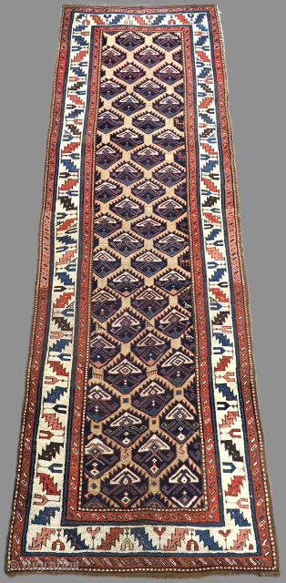 Antique South Caucasian Gendje or Shahsavan runner, with all over lattice and shrub design.
Size: 11ft 6in x 3ft 8in (350 x 112cm).
Circa 1880.
The runner has a camel coloured lattice that contains a ...