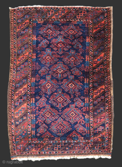 Size: 2ft 4in x 1ft 7in (71 x 48cm).

Antique Sistan Baluch pushti bag face with a repeat design, on a dark indigo blue ground.

Circa 1900.

Pushti were used as pillows or back rests,  ...