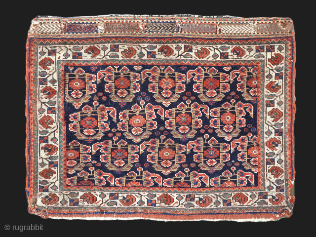 Size: 2ft 6in x 1ft 11in (76 x 58cm).

Antique saddle bag face by the Afshar tribe with large boteh design.

Circa 1880.

The bag face has three rows of large floral boteh on a  ...