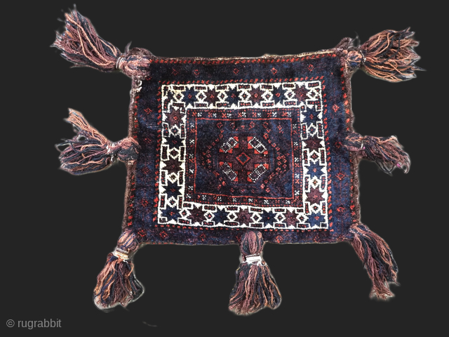 Size: 1ft 5in x 1ft 2in (43 x 35cm). Face size.

Antique Baluch double faced vanity bag with original long tassels.

Circa 1900/20.

This small vanity bag was made by the Baluch nomads of Sistan  ...
