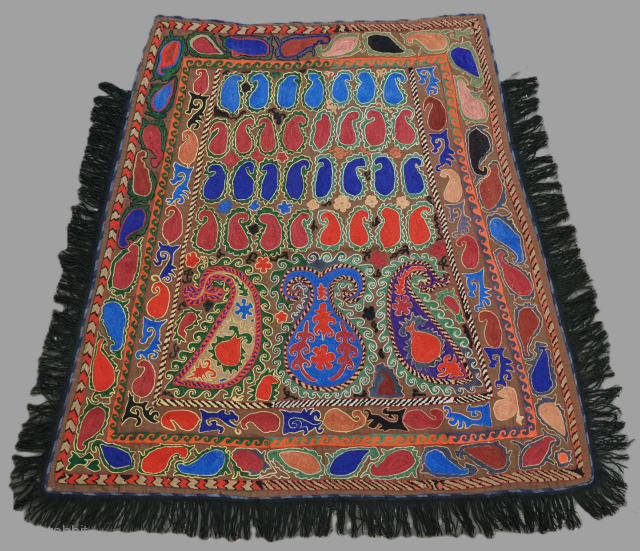 Antique Uzbek Lakai tribal ceremonial horse / saddle cover.
Size: 4ft 4inx 4ft 1in (131 x 124m) excluding tassels.
Circa 1920.
This beautiful embroidered horse / saddle cover was made by the Lakai tribe of ...