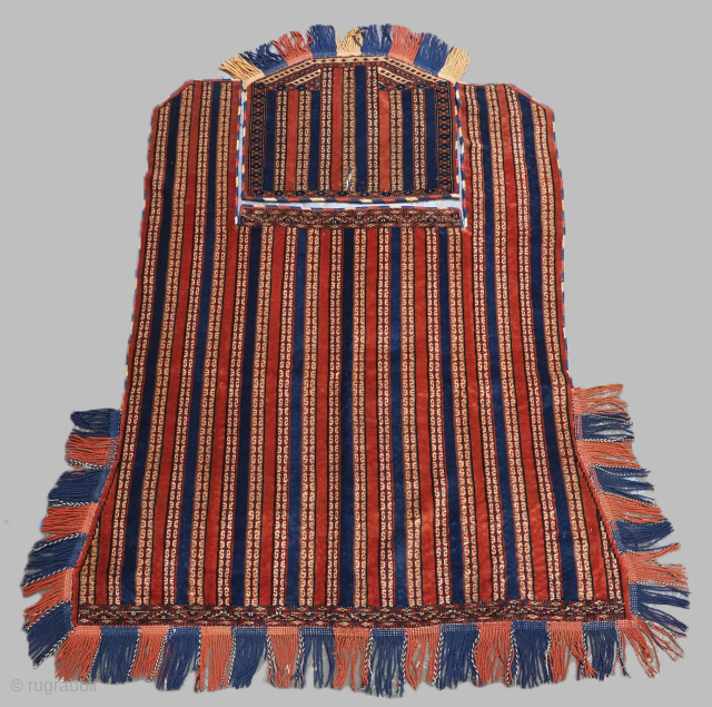 Antique Yomut Turkmen tribal ceremonial horse cover & saddle rug.
Size: Blanket 5ft 0in x 4ft 4in (152 x 132cm) excluding tassels. Saddle rug 1ft 7in x 2ft 0in (47 x 61cm) excluding ...