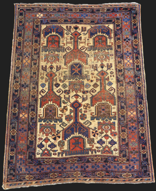 Size: 4ft 9in x 3ft 8in (146 x 111cm).

Antique Afshar Neriz rug of repeat shield design on an ivory ground.

2nd half 19th century..

An interesting and early example of a Afshar Neriz rug  ...