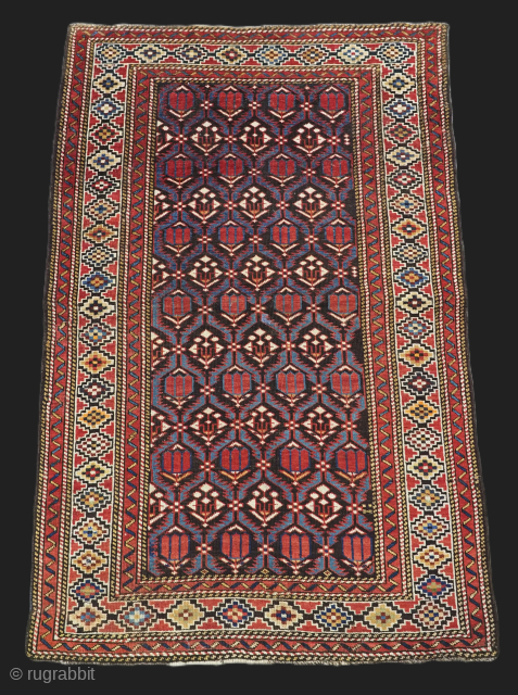 Size: 5ft 1in x 3ft 3in (156 x 100cm).

Antique Caucasian Shirvan rug with floral 'tulip' lattice on a dark indigo blue ground.

Circa 1890.

A good example of type with very nicely coloured tulips  ...