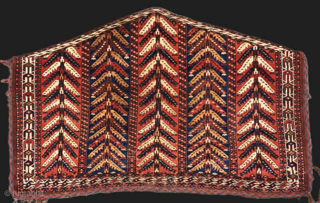Size: 4ft 2in x 2ft 7in (126 x 78cm).

Antique Yomut Turkmen asmalyk with 'tree' design.

Mid 19th century.

This superb example of a Yomut Turkmen asmalyk has the very scarce 'tree' design, also known  ...
