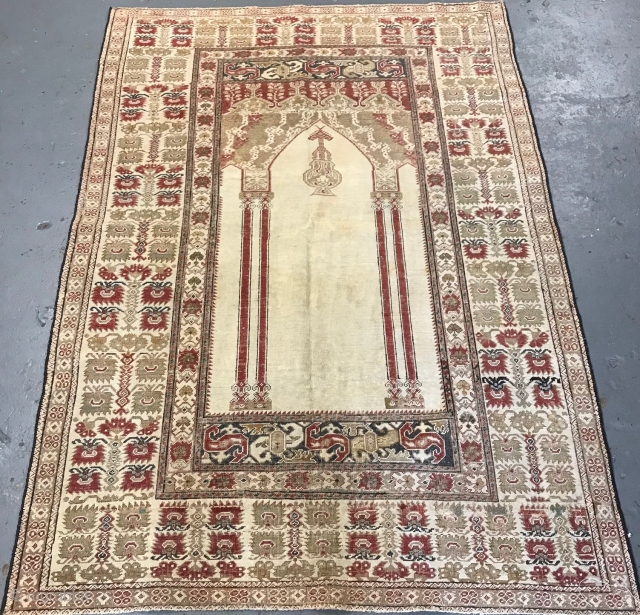 White ground Ghiordes prayer rug, early 19th century.                         